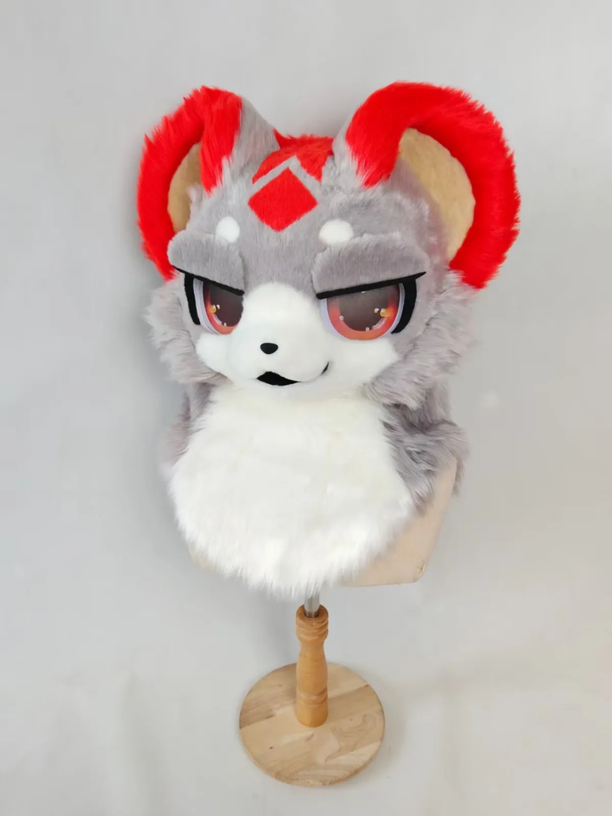 Grey & red ram horn head
