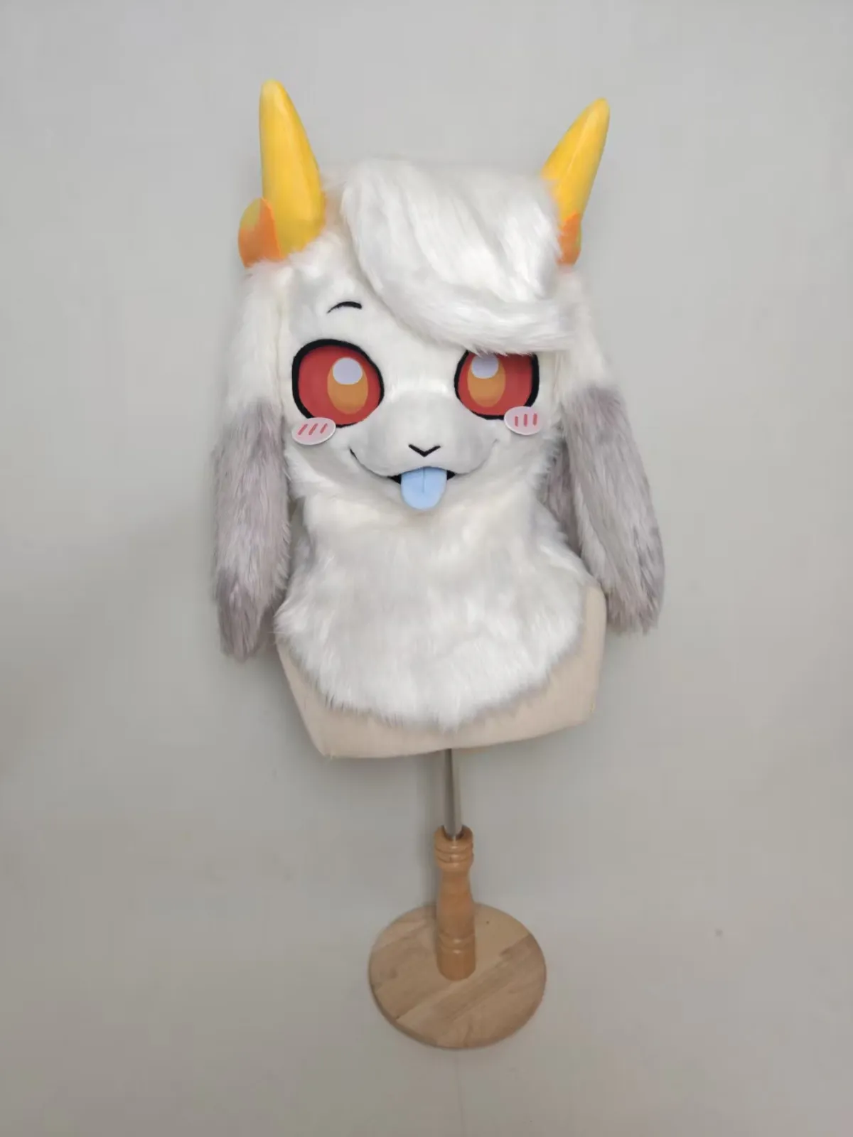 White horned creature head