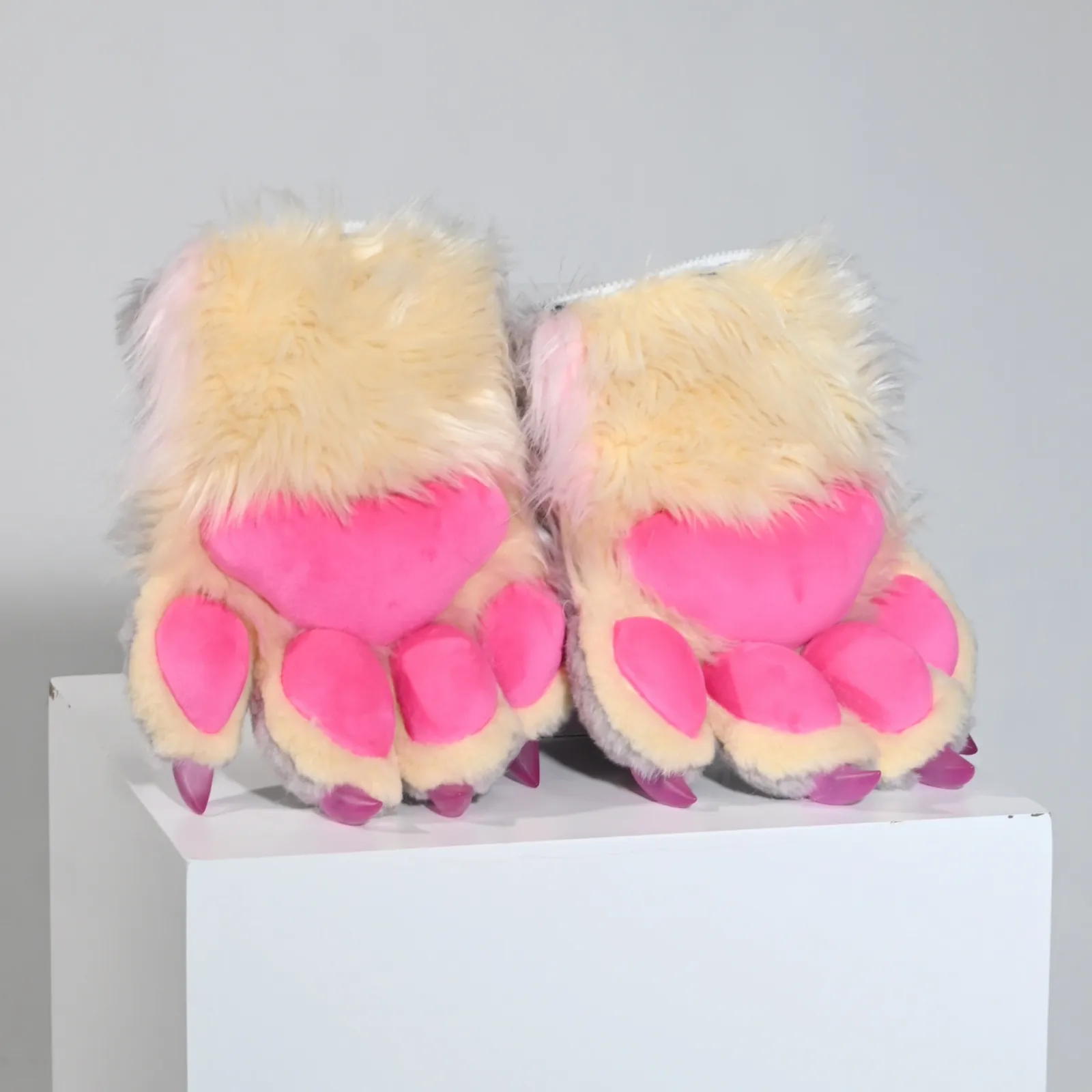 Cream fursuit paws with hot pink pads and purple claws