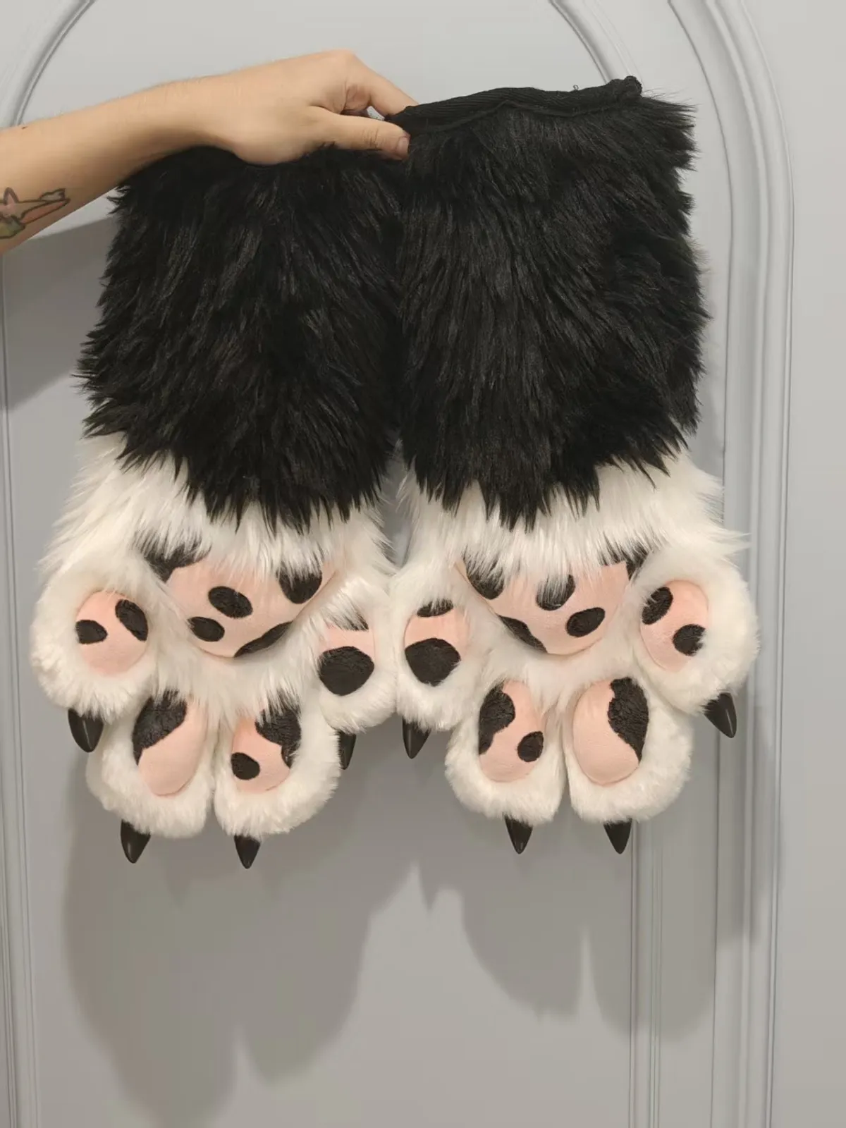 Black & white cow-spot paws with pink pads